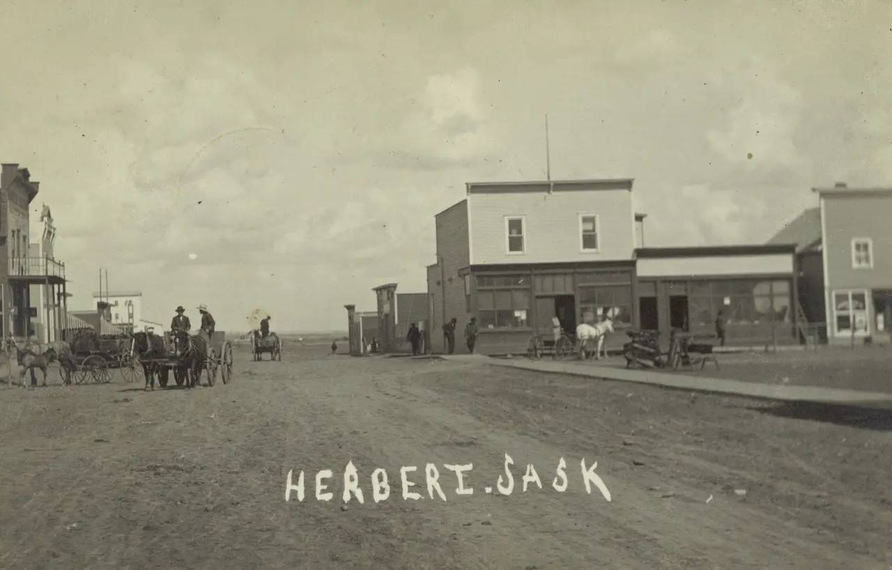 Street scene with horse-drawn wagons, about 1911